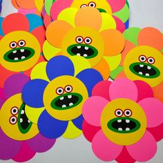 many colorful flowers with faces on them