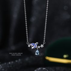 Color: White Gold Color Necklace Style: Fashion OL Blue Pendant Clavicle Chain Necklace, Blue Pendant Chain Necklace With Clavicle Chain, Elegant Silver Necklace With Bird Shape, Stone Pendant Light, Womens Diamond Necklace, Space Necklace, Handmade Charm Bracelets, Solid Gold Charms, Acid Base