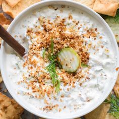 a white bowl filled with cucumber and crackers