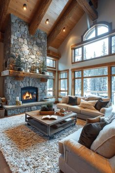 a living room filled with lots of furniture and a fire place in the middle of it