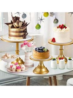 three tiered cake stands with different types of cakes on them