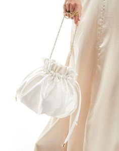 Accessories.by.True Decadence.Bag yourself the ultimate accessory.Pouch design.Chain strap.Drawstring closure.Product Code: 133685877 Wedding Shoulder Bag With Detachable Strap, White Pouch Shoulder Bag For Evening, White Evening Pouch Shoulder Bag, Cream Shoulder Bag For Evening Party, Cream Evening Shoulder Bag For Parties, Feminine Shoulder Evening Bag For Party, Cream Shoulder Evening Bag For Party, Elegant Crossbody Pouch With Adjustable Strap, White Evening Bags With Chain Strap