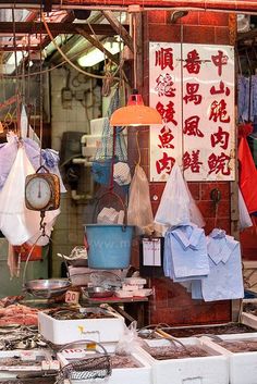 an outdoor market with various items for sale