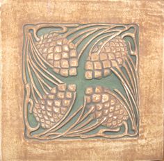 a decorative tile in the shape of pine cones