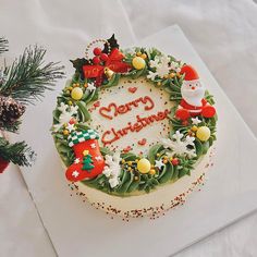 a decorated christmas cake sitting on top of a table