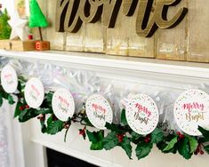 some christmas decorations are hanging on the mantle