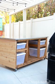 a kitchen island made out of wood and plastic containers