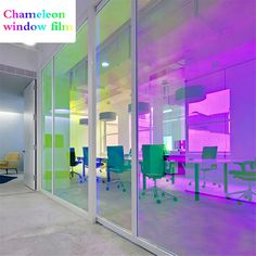 an office with colorful glass walls and chairs