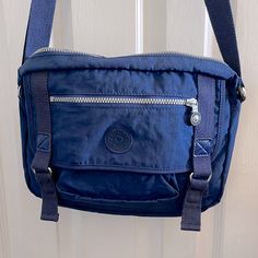 Kipling Messenger Bag/Satchel. Looks Like A Cool Messenger Bag Or Satchel. Color Is True Blue To Darker Blue In Shade Straps Are Material. Used Once. Looks Brand New. 12”Long X 91/2” H Excellent Condition. Messenger Bag Kipling, Blue Pouch Satchel For School, Casual Blue Satchel With Zipper Pocket, Versatile Blue Shoulder Bag With Pockets, Blue Casual Pouch Satchel, Casual Blue Satchel Shoulder Bag, Casual Blue Pouch Satchel, Casual Blue Shoulder Bag Satchel, Casual Blue Shoulder Satchel