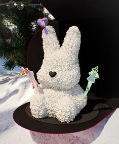 a cake shaped like a bunny sitting on top of a table