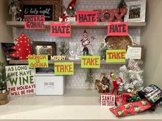 christmas decorations are displayed on shelves in the corner of a room with holiday cards and gifts