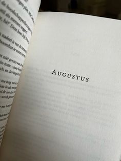 an open book with the word august written in black ink on it's pages