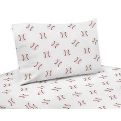 the baseball sheet set is white and has red stitches on it, along with two pillow cases