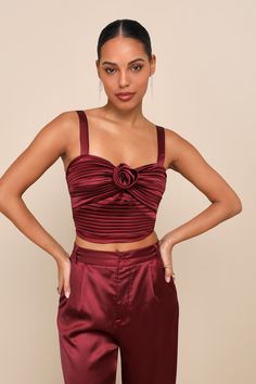 The Lulus Flawless Behavior Burgundy Satin Pleated Rosette Tank Top is a perfectly flirty option for any special occasion or celebration! Sleek pleated woven satin shapes this too-cute top that features a cropped, twist-front bodice adorned with a removable rosette motif at the center and a subtle sweetheart neckline, all supported by adjustable tank straps. Smocking at the back allows for the perfect fit. Fit: This garment fits true to size. Length: Size medium measures 15.5" from adjustable st Rosette Top, Casual Formal Dresses, Top Satin, Lulu Fashion, Pleated Top, Pleat Top, Casual Wedding Dress, Adhesive Bra, Lovely Tops