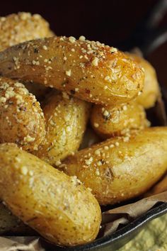 some bread sticks are in a bowl on a table