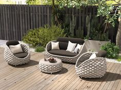 an outdoor furniture set on a wooden deck