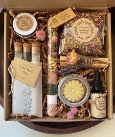 an open box filled with different types of soaps and other things to use for the body