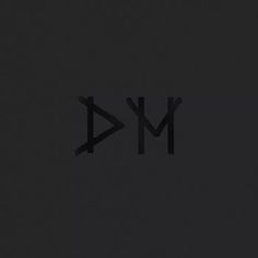 the letters m and d are made up of black paper on a dark background,