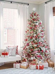 an instagram christmas tree with red and white ornaments