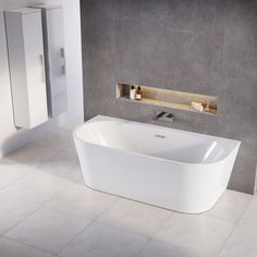 a white bath tub sitting on top of a tiled floor