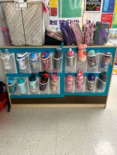 a blue shelf filled with lots of plastic containers