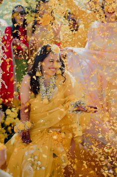 the bride and groom are surrounded by confetti