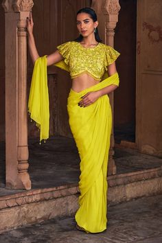 Yellow blouse with all over floral jaal work using crystals, sequins and glass beads. Paired with a pre-draped skirt saree. - Aza Fashions Festive Yellow Pre-draped Saree, Pre-draped Georgette Saree In Traditional Style, Fitted Lehenga With Draped Sleeves And Traditional Drape, Elegant Yellow Pre-draped Saree With Traditional Drape, Fitted Silk Pre-draped Saree For Navratri, Fitted Pre-draped Saree With Draped Sleeves For Diwali, Festival Georgette Pre-draped Saree With Cape Sleeves, Fitted Pre-draped Saree With Zari Work And Cape Sleeves, Yellow Fitted Georgette Pre-draped Saree