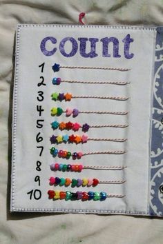 a cross stitch book with the words count on it and colorful pins in each row