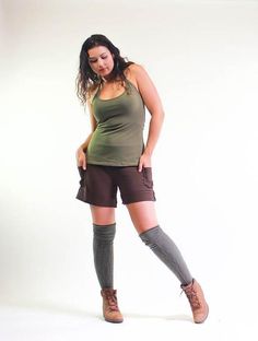 Available Colors and SizesBlack: S,M,LSage Green: S,M,LChocolate Brown: S,M,L1st cousin to our best selling Yoga Cargo pants, these shorts are versatile, comfortable and flattering. The classic yoga fold down waist is combined with a drawstring for added security. These shorts can be high waisted, mid rise or hip huggers. You decide. Small cargo pockets on both sides sit just above the folded up cuffs, adding to practicality and style. Snug fitting on the waist and hips, flaring slightly into th Fitted Cotton Shorts Mid-thigh Length, Fitted Above Knee Cotton Bottoms, Fitted Cotton Mid-thigh Shorts, Fitted Cotton Mid-thigh Length Shorts, Above Knee Athletic Shorts For Yoga In Summer, Khaki Athletic Shorts With Built-in Liner, Summer Yoga Athletic Shorts Above Knee, Above Knee Athletic Shorts For Yoga, Casual Fitted Above Knee Shorts