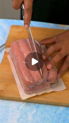 a person cutting up meat with a knife