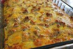 a casserole dish with meat and cheese in it