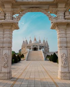 an ornate white building with pillars and arches