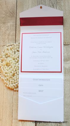 the wedding stationery is laid out on top of the wood floor, ready for guests to arrive