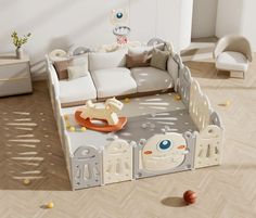 a baby's playpen in the middle of a room with toys on the floor