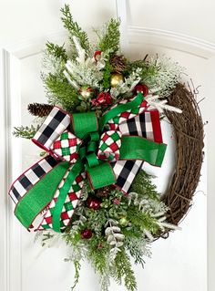 a christmas wreath hanging on the front door