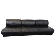 a black leather couch on a white background