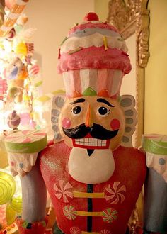 a large nutcracker statue sitting on top of a table