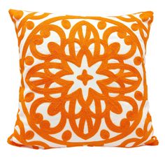 an orange and white pillow on a white background