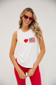 Show your spirit in the IN LOVE WITH AMERICA TANK. We love how soft this tank is and its so easy to throw on over your favorite swimsuit or your favorite bottoms! Product Details: White fabric color Rounded neckline True to size Hand wash only Julia" is 5’8 and is wearing a size small. All orders are currently shipping within 14 business days. To receive item quicker, expedited shipping is available at checkout. Casual Sleeveless Top For Poolside, White Sleeveless Top For Poolside, White Tank Top For Poolside Summer, American Tank, Small Tank, Rounded Neckline, White Fabric, White Fabrics, Fashion Tees