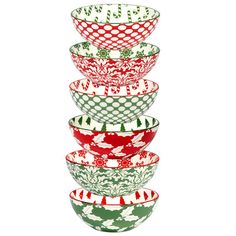 a stack of red and green bowls sitting on top of each other in front of a white background