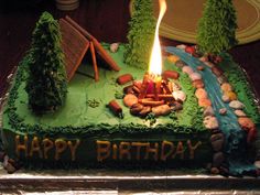 a birthday cake with a campfire on it