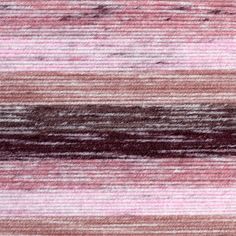 an area rug with pink, brown and white stripes