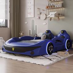 a child's bedroom with a blue car bed