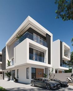 two cars are parked in front of a modern building with balconies and balconies on the second floor