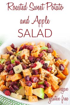 roasted sweet potato and apple salad in a white bowl with cranberries on the side