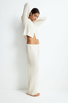 Fitted pants in a sheer rib knit. Elasticized waistband  straight legs  and gently flared hem with overlocked edge. Ribbed Pants, Fitted Pants, Kid Cudi, Classic Feminine, Sweater Blazer, Cardigan Sweater Jacket, Suits And Jackets, Blouse Pants, Kids Outerwear