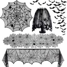 an assortment of halloween decorations including bats, spider webs and netted tablecloth