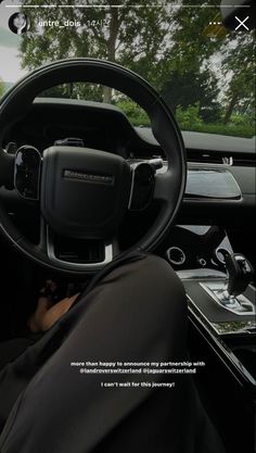 the interior of a car with an image of a man driving in front of it