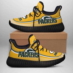 a pair of yellow sneakers with green bay packers logo on the side and black bottom