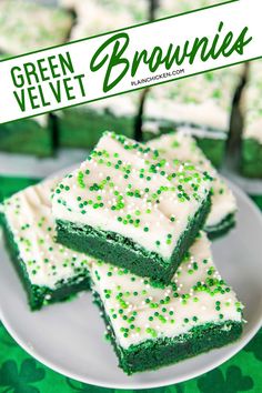 green velvet brownies with white frosting and sprinkles on a plate